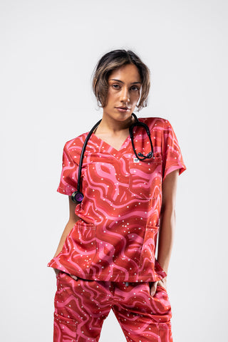 Person wearing a red patterned outfit with a stethoscope on a white background